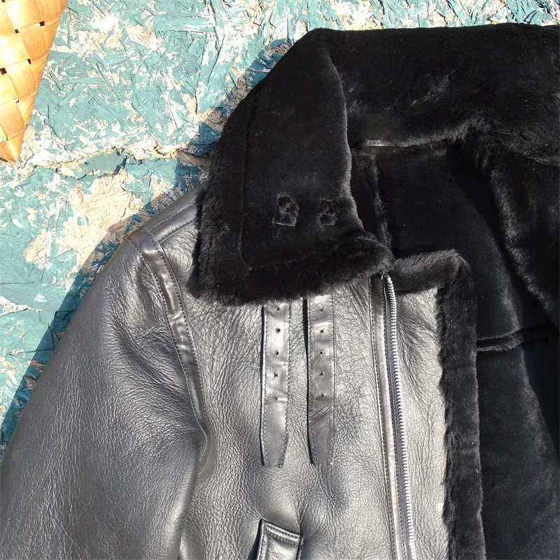 Man wearing a heavy shearling coat demonstrating advanced cold-weather layering techniques