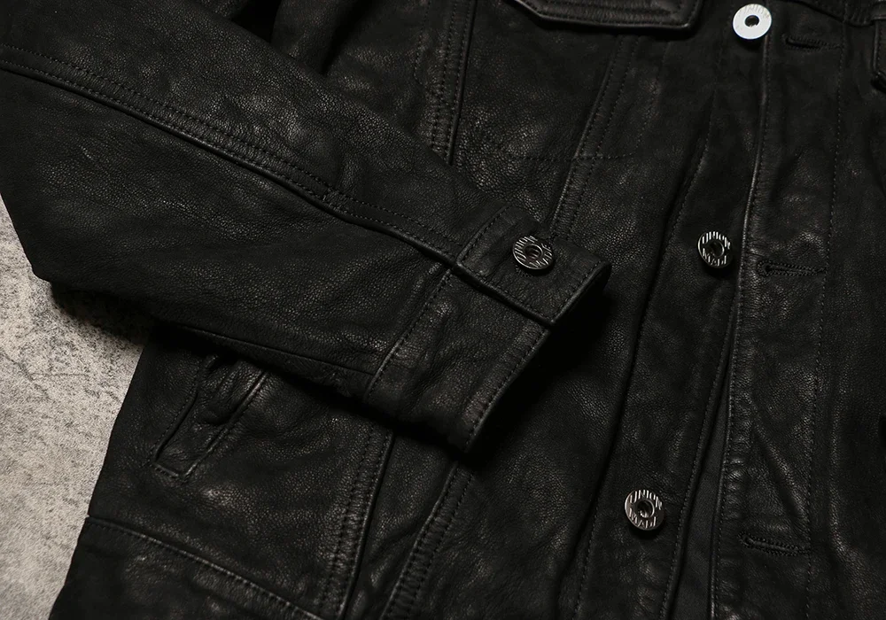 Classic formal leather coat with perfect collar positioning demonstrating removal etiquette