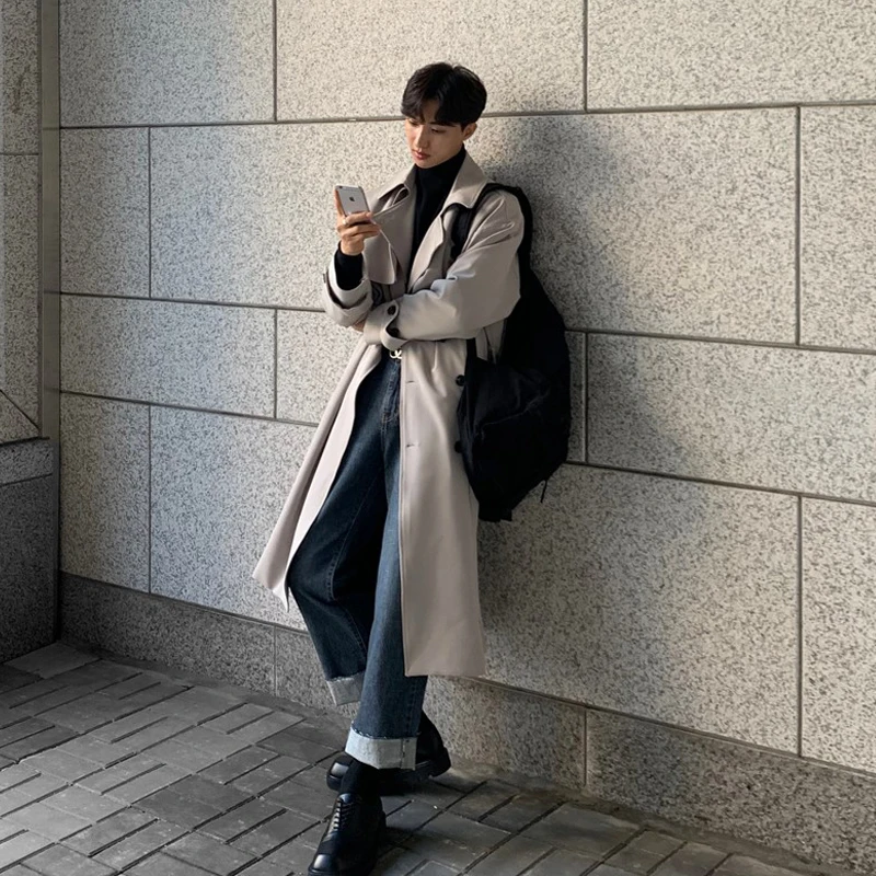 Elegant double breasted coat properly styled with formal accessories