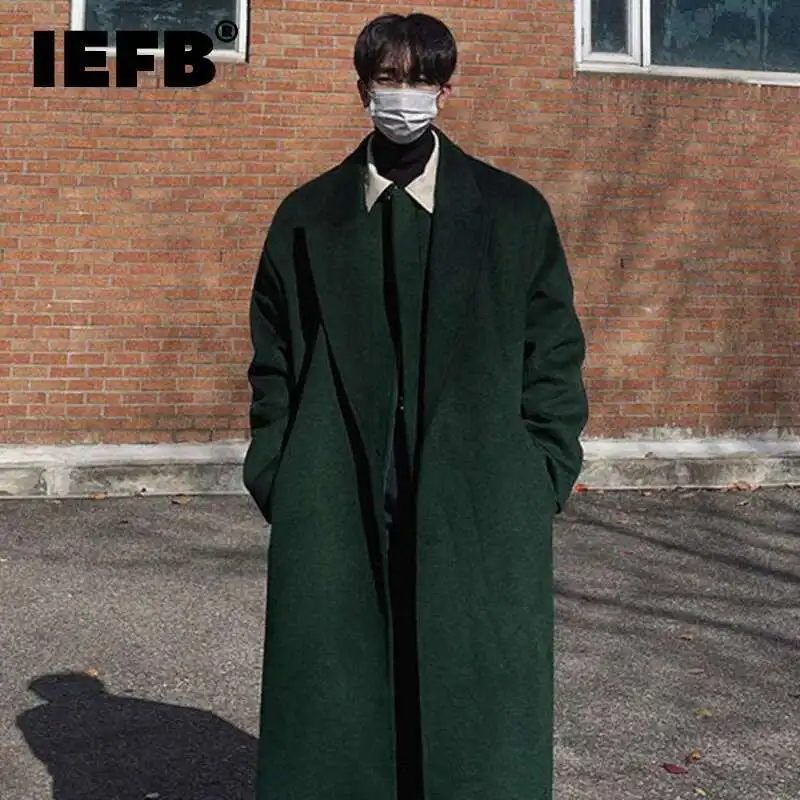 Properly fitted classic pea coat on a male model showing ideal proportions