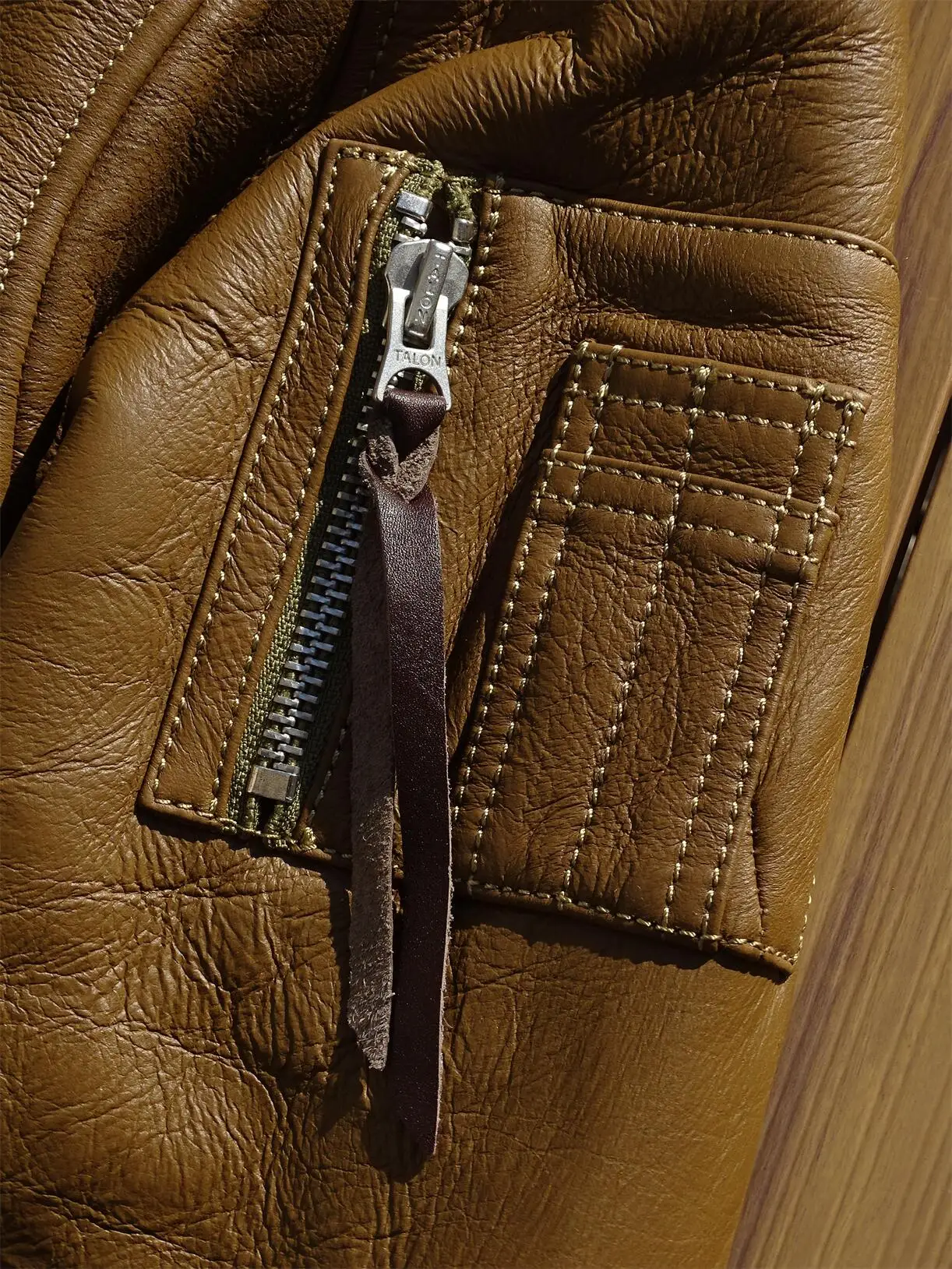 Side by side comparison of shearling and sheepskin textures in luxury outerwear